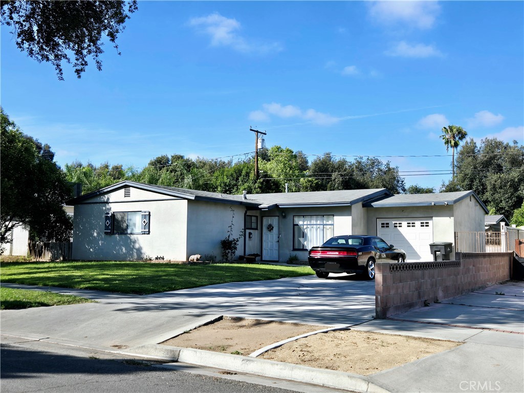 3076 Ronald Street Riverside, CA 92506 - Photo 3 of 19 a front view of a house with a yard