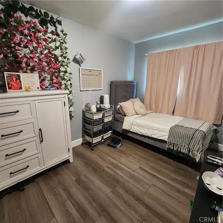 a bedroom with bed and a window