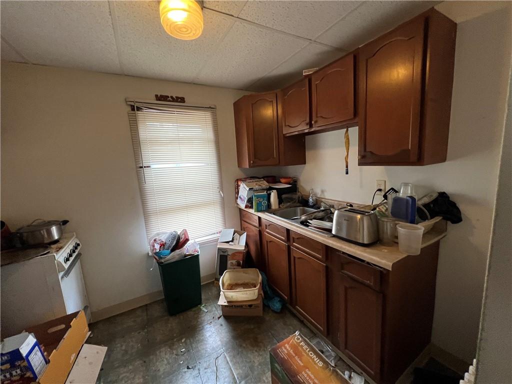 519 Roup Street Tarentum, PA 15084 - Photo 4 of 13 a kitchen with sink cabinets and appliances
