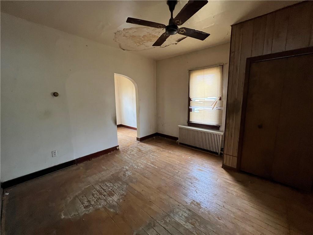 519 Roup Street Tarentum, PA 15084 - Photo 10 of 13 a view of empty room with wooden floor and fan