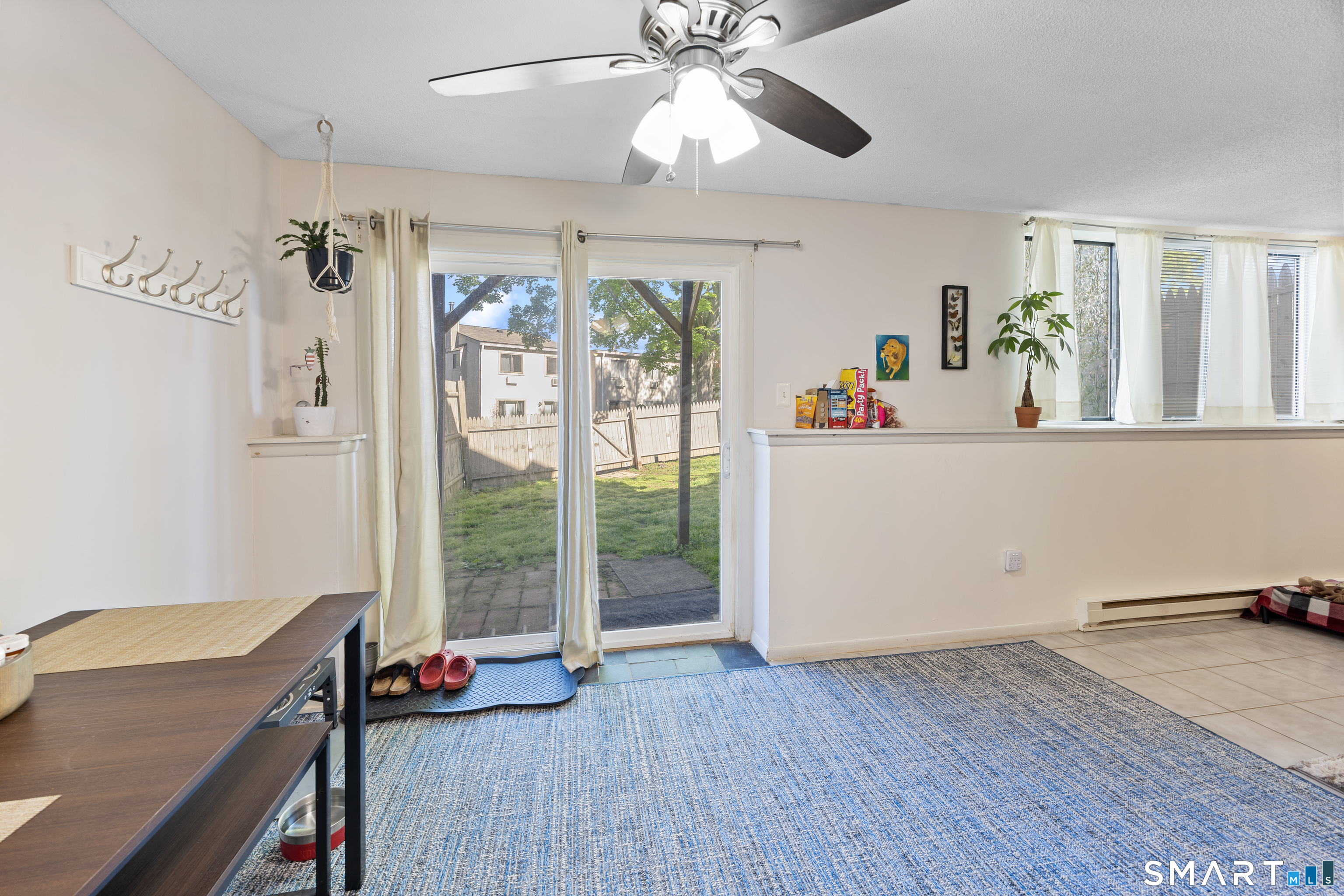 560 Yale Avenue, Unit 82 Meriden, CT 06450 - Photo 9 of 22 a view of a livingroom with wooden floor and a ceiling fan