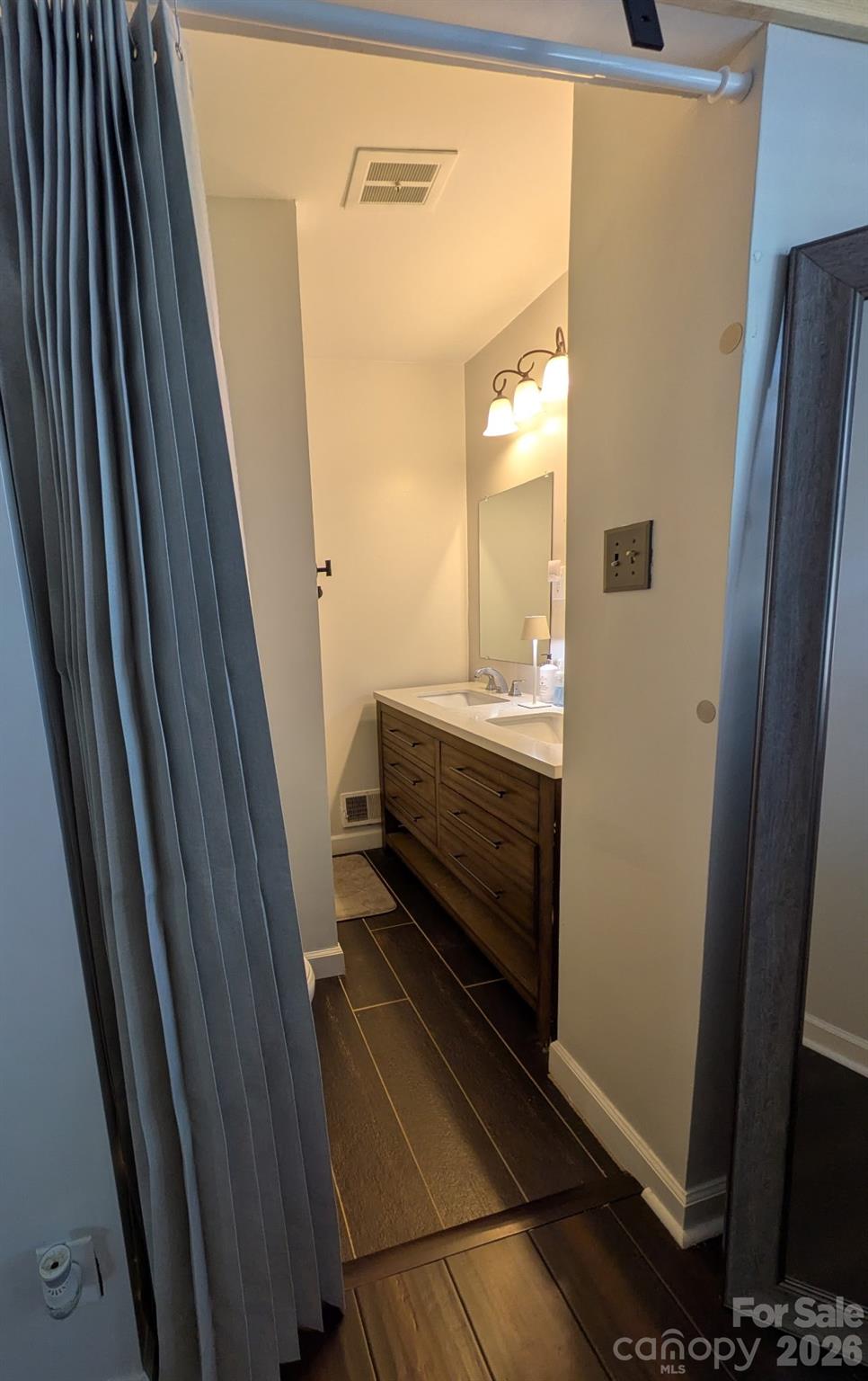 109 Churchill Road Dallas, NC 28034 - Photo 15 of 40 a bathroom with a sink a mirror and shower