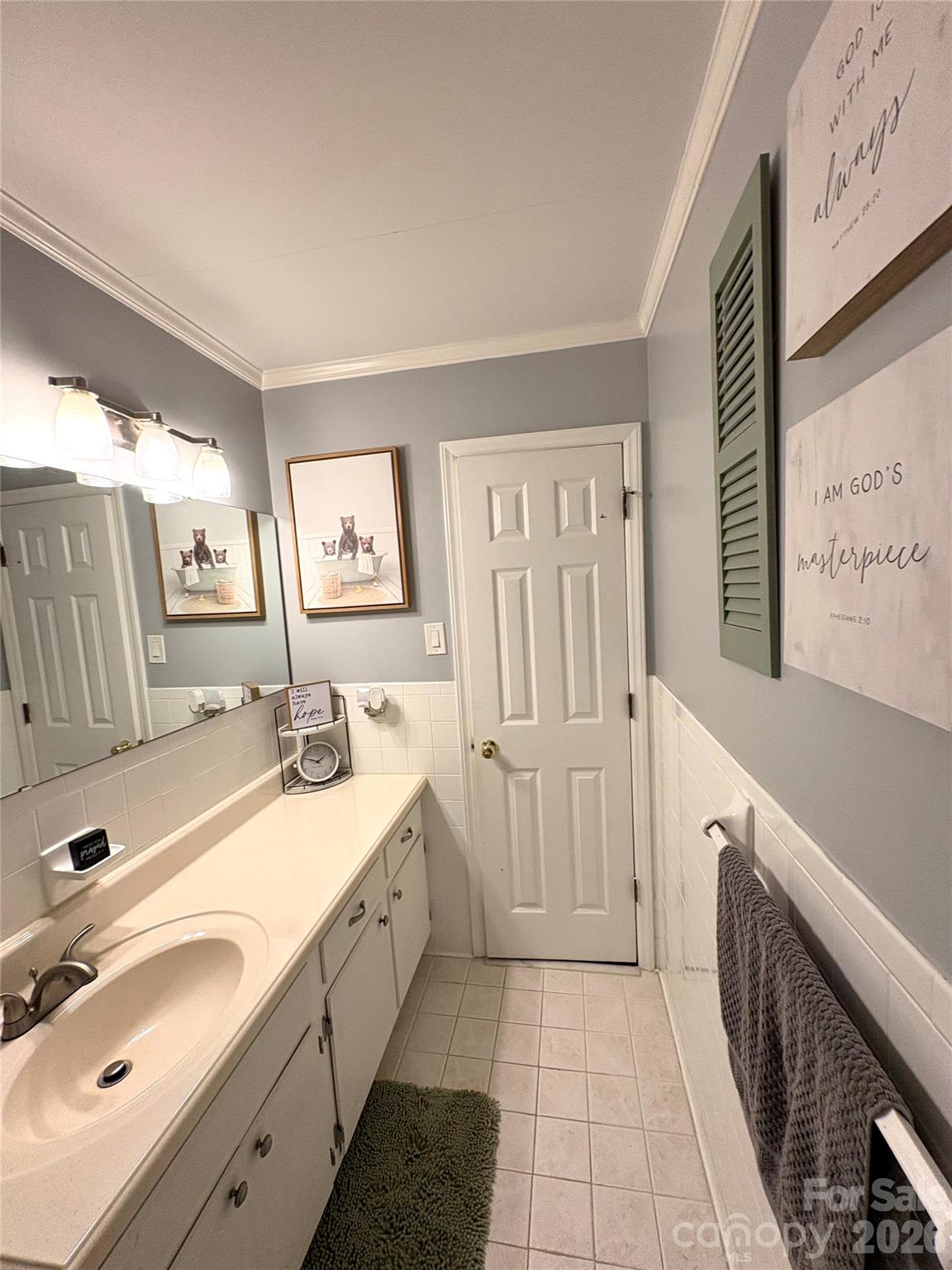 109 Churchill Road Dallas, NC 28034 - Photo 19 of 40 a spacious bathroom with double vanity sink and a mirror