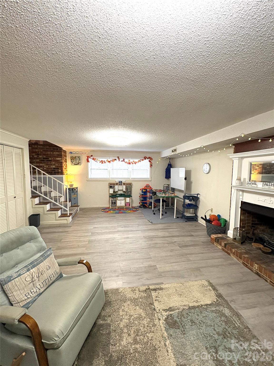 109 Churchill Road Dallas, NC 28034 - Photo 22 of 40 a living room with furniture and a flat screen tv
