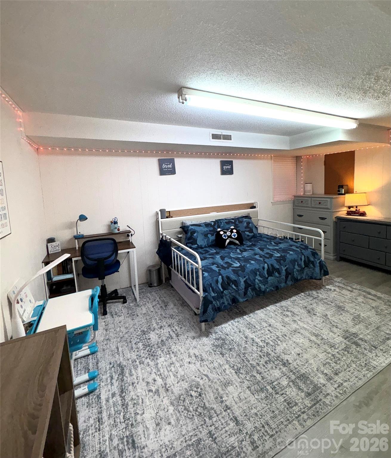 109 Churchill Road Dallas, NC 28034 - Photo 25 of 40 a living room with furniture and a flat screen tv