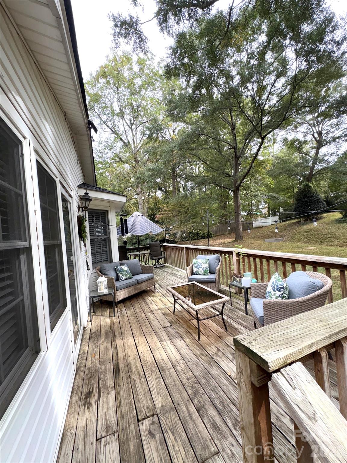 109 Churchill Road Dallas, NC 28034 - Photo 27 of 40 a view of balcony with chairs and wooden fence