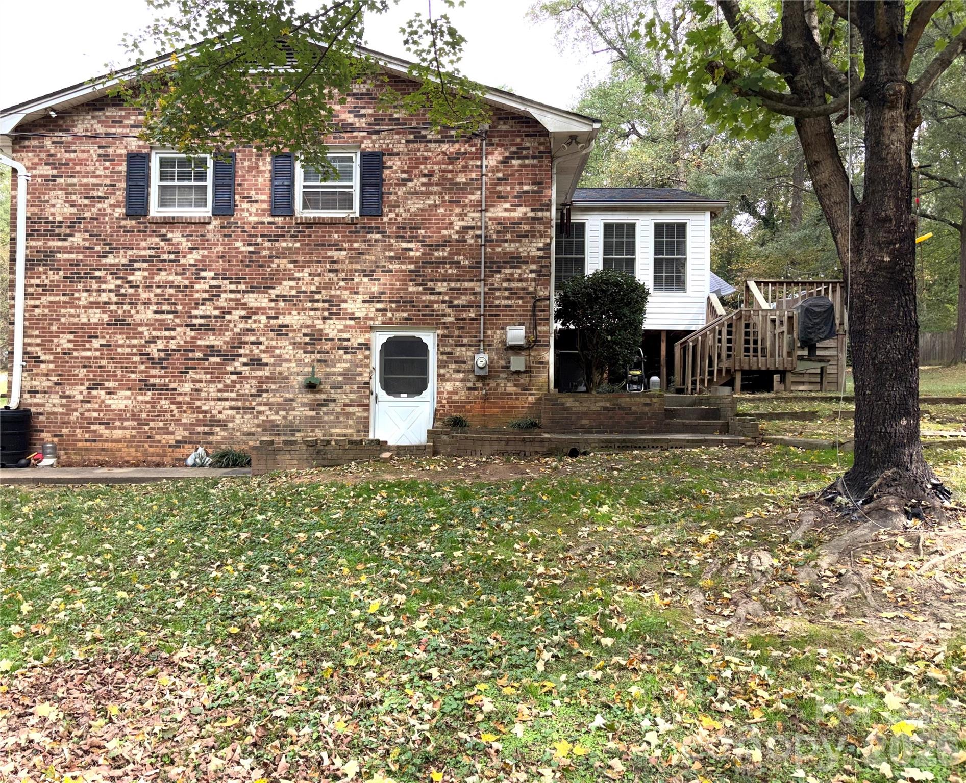 109 Churchill Road Dallas, NC 28034 - Photo 3 of 40 a view of a house with backyard and a tree