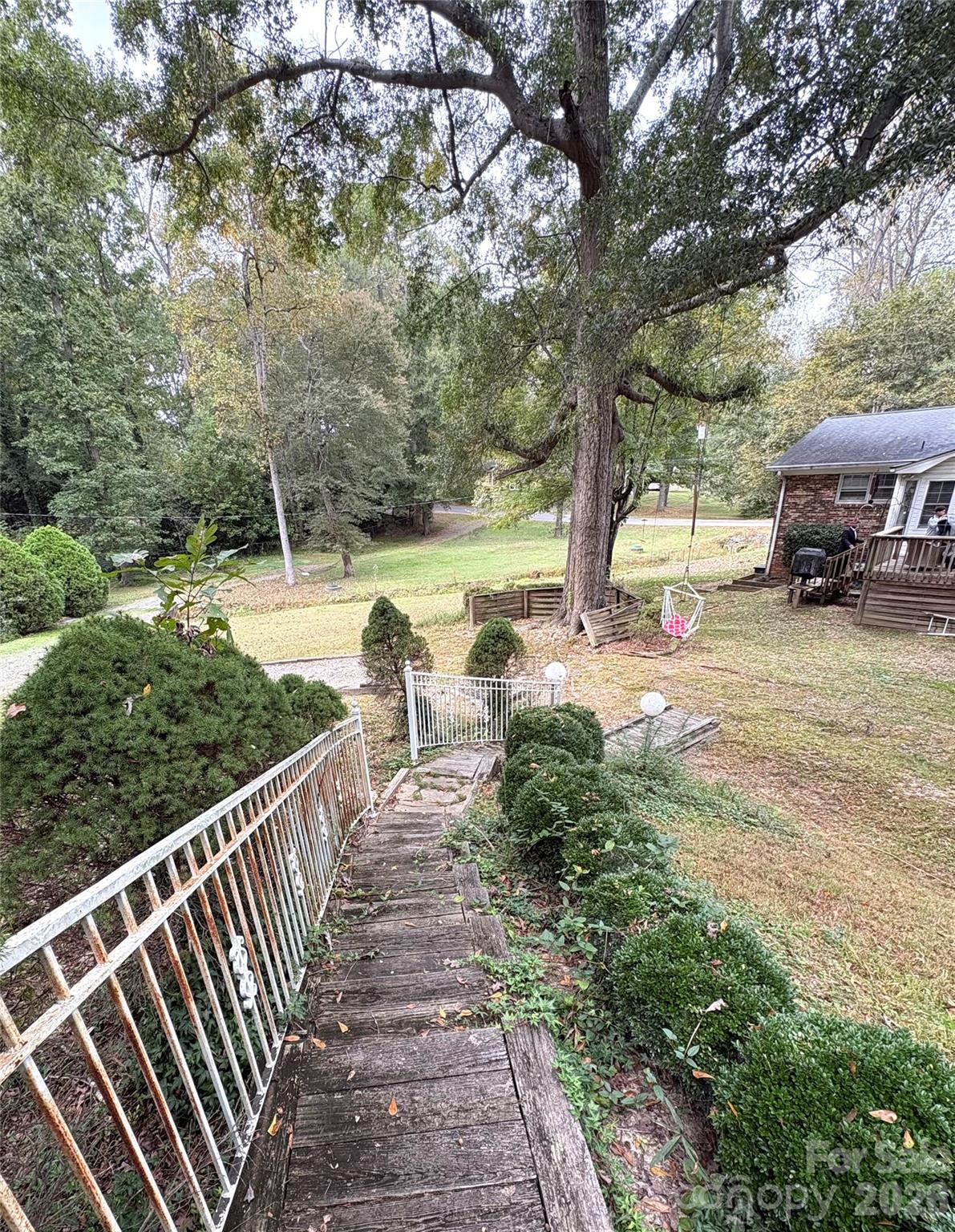109 Churchill Road Dallas, NC 28034 - Photo 32 of 40 a view of a garden with wooden fence