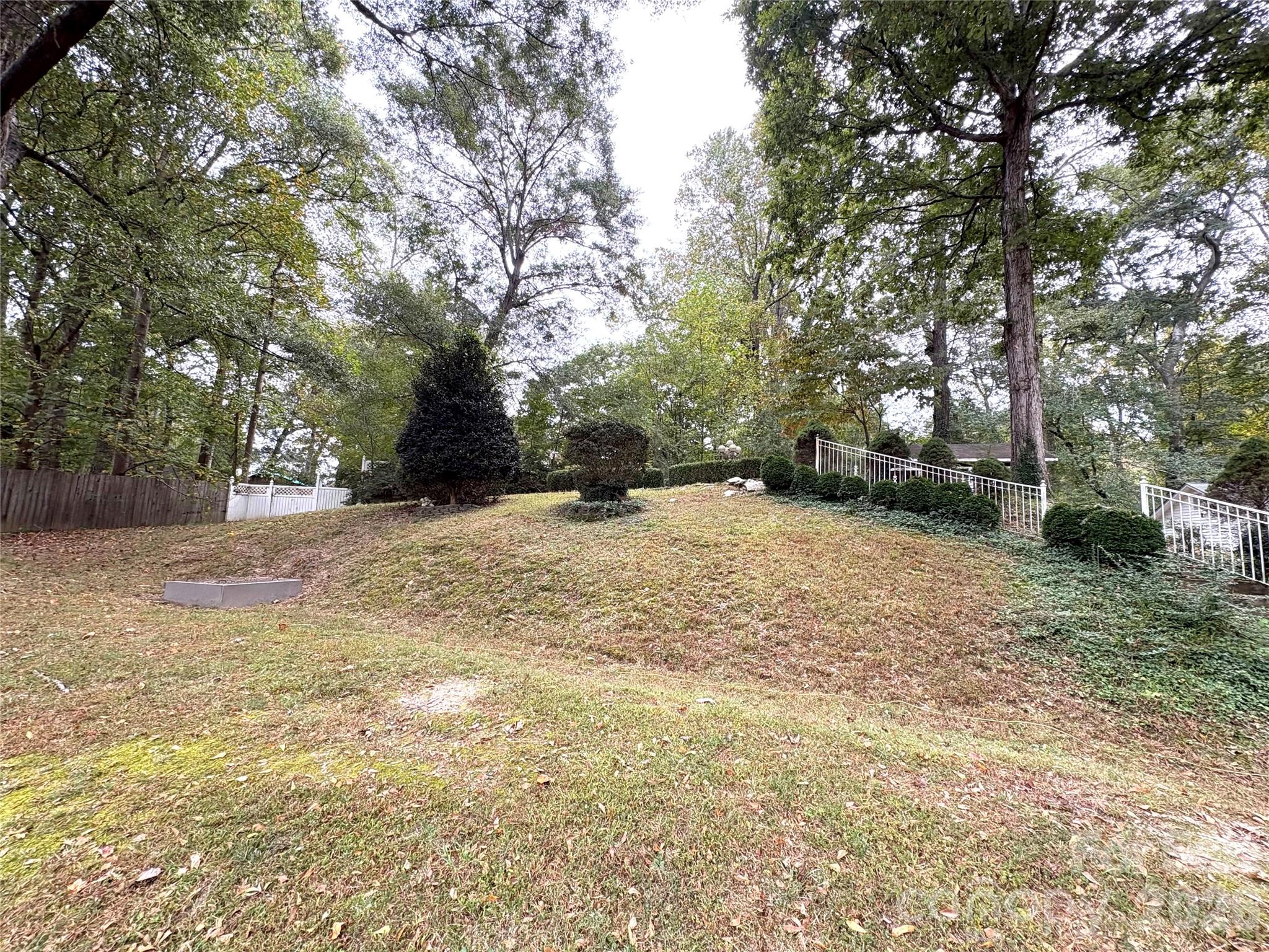 109 Churchill Road Dallas, NC 28034 - Photo 34 of 40 a view of a yard with a tree