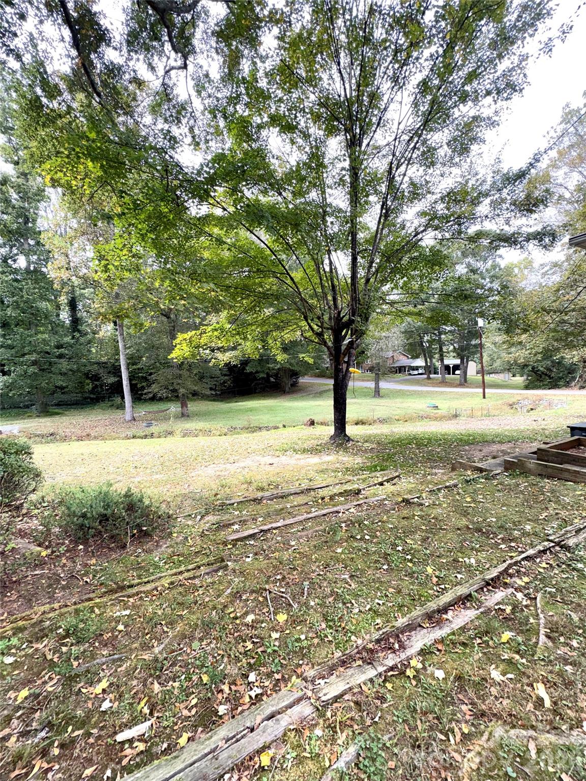109 Churchill Road Dallas, NC 28034 - Photo 37 of 40 a view of yard with swimming pool and trees