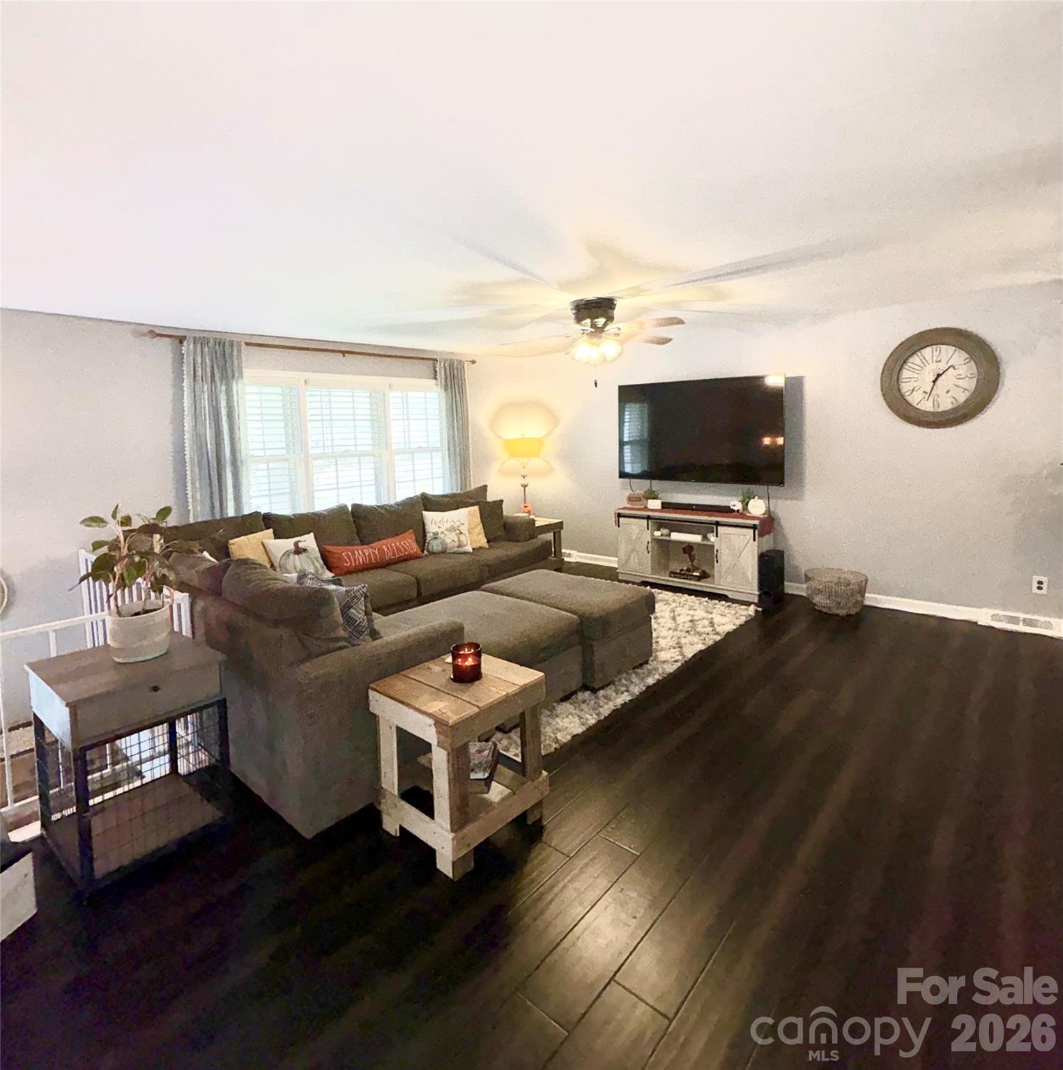 109 Churchill Road Dallas, NC 28034 - Photo 5 of 40 a living room with furniture and a flat screen tv