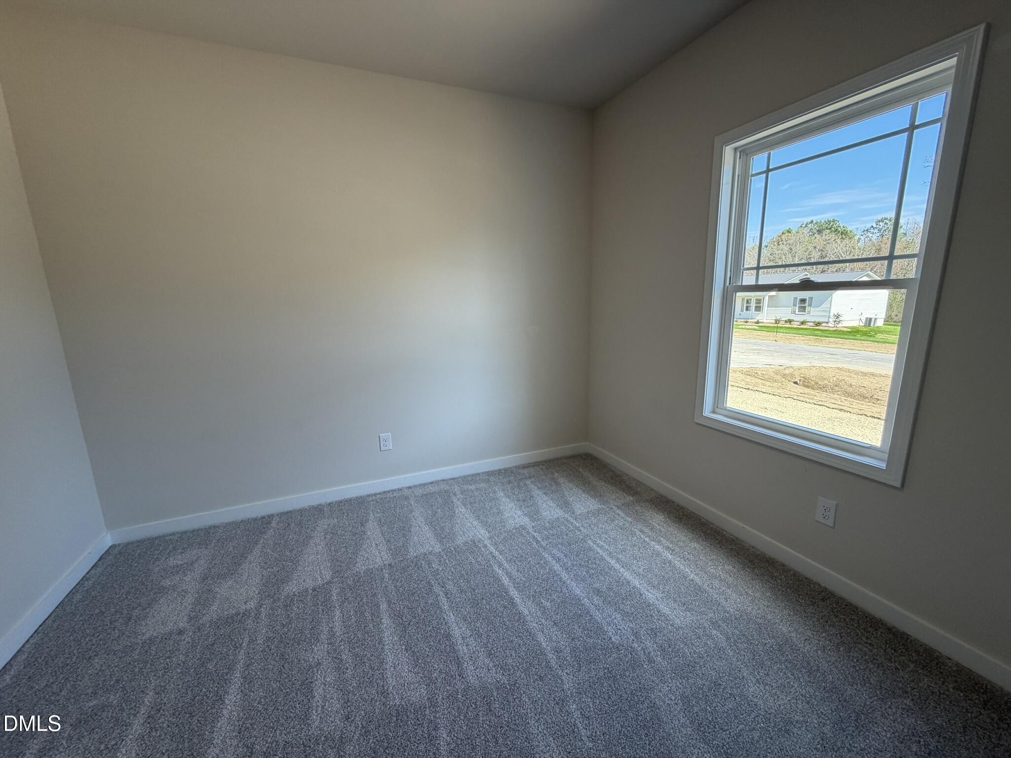 159 Jacobs Ridge Drive Four Oaks, NC 27524 - Photo 16 of 18 a view of an empty room and window
