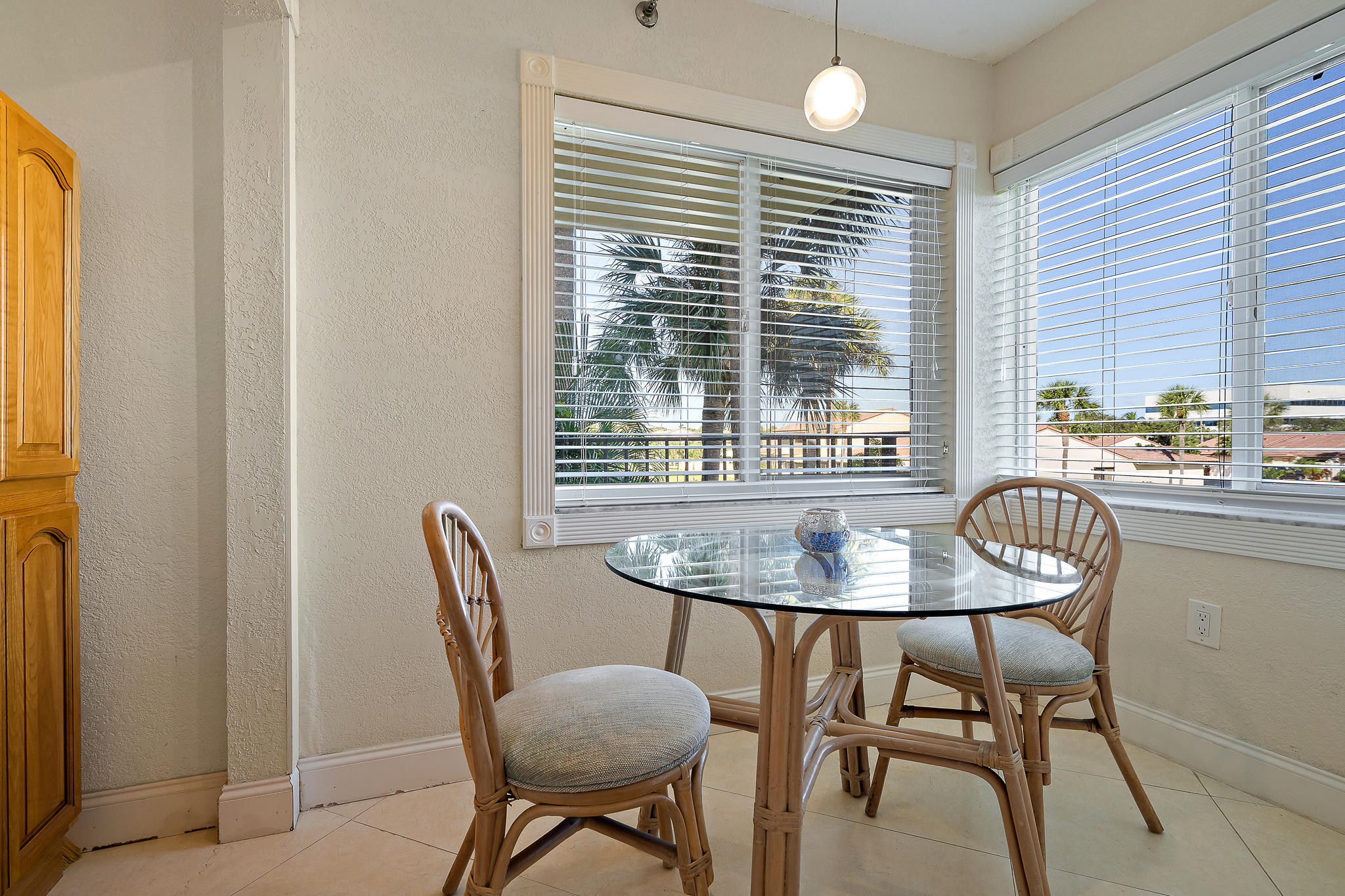 275 Palm Avenue, Unit C201 Jupiter, FL 33477 - Photo 17 of 24 a dining room with furniture and window