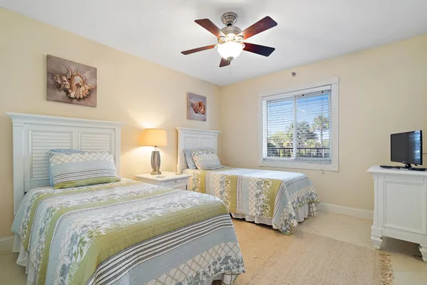 a bedroom with a bed and a window with the outer view