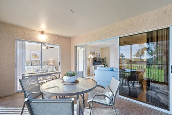 a view of a dining room with furniture window and outside view