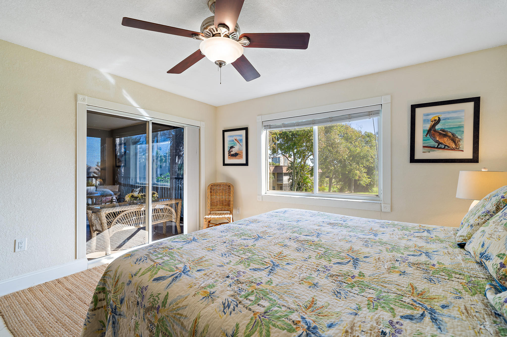 275 Palm Avenue, Unit C201 Jupiter, FL 33477 - Photo 7 of 24 a bedroom with a large bed and a large window