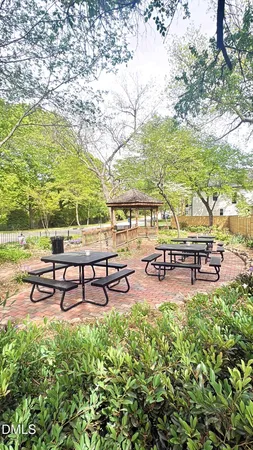 a swimming pool with outdoor seating and yard