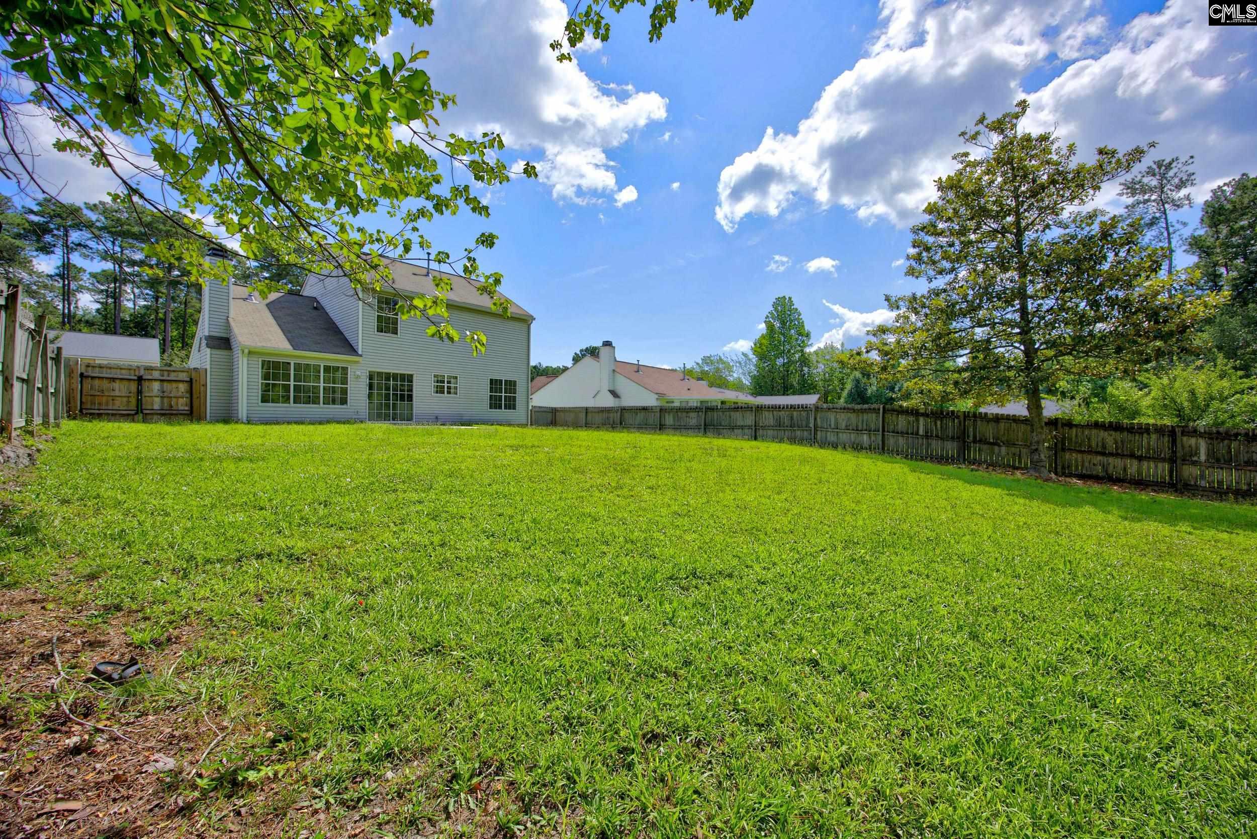 407 Sesqui Trail Columbia, SC 29223 - Photo 32 of 34 a front view of a house with garden