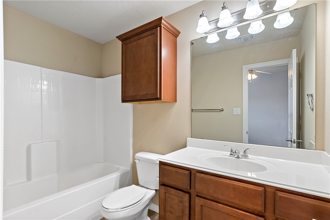 1198 Jones-Butler Road, Unit 1402 College Station, TX 77840 - Photo 16 of 20 a bathroom with a sink a toilet and shower