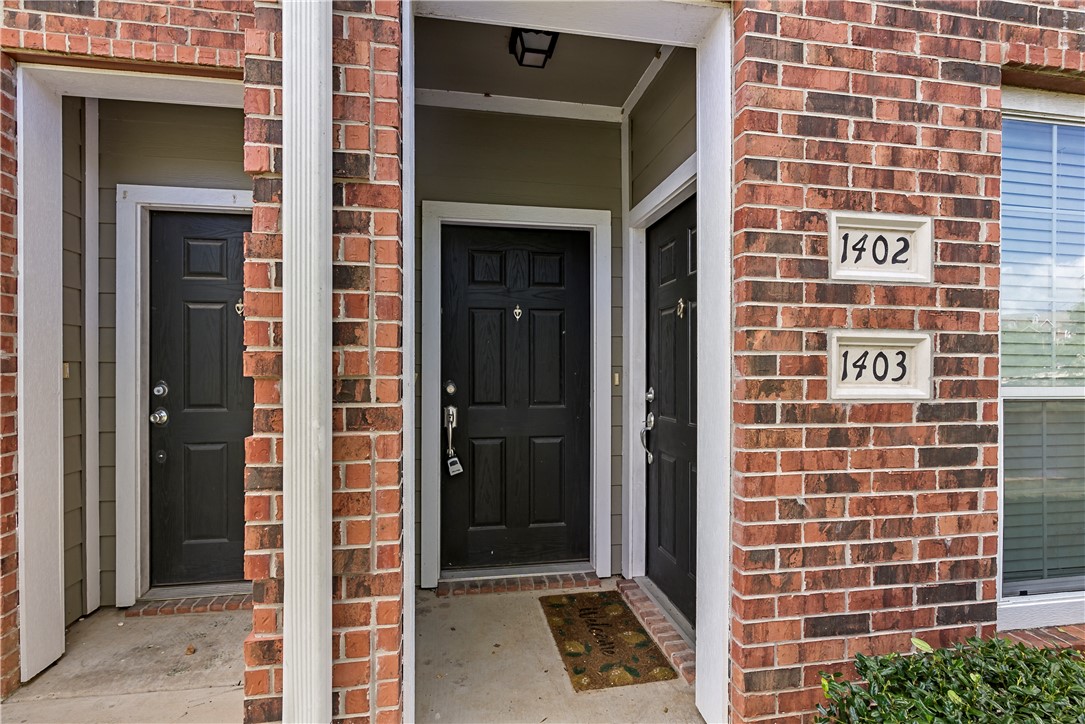1198 Jones-Butler Road, Unit 1402 College Station, TX 77840 - Photo 3 of 20 a view of a door with brick walls