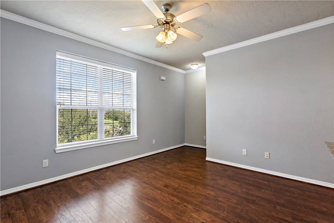 1198 Jones-Butler Road, Unit 1402 College Station, TX 77840 - Photo 9 of 20 wooden floor in an empty room with a window