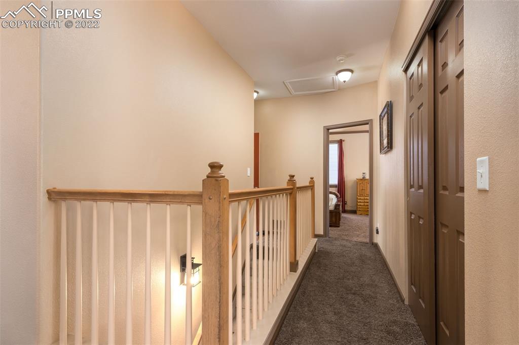 7542 Stephenville Road Peyton, CO 80831 - Photo 12 of 32 a view of a hallway with wooden floor and entryway