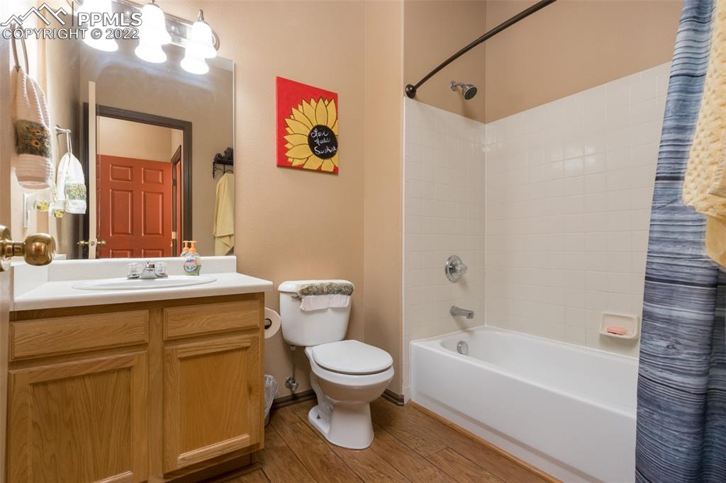 7542 Stephenville Road Peyton, CO 80831 - Photo 13 of 32 a bathroom with a toilet sink vanity tub and shower