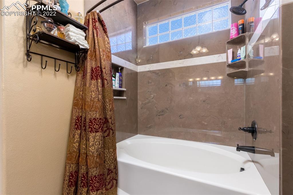 7542 Stephenville Road Peyton, CO 80831 - Photo 17 of 32 a bathroom with a bathtub