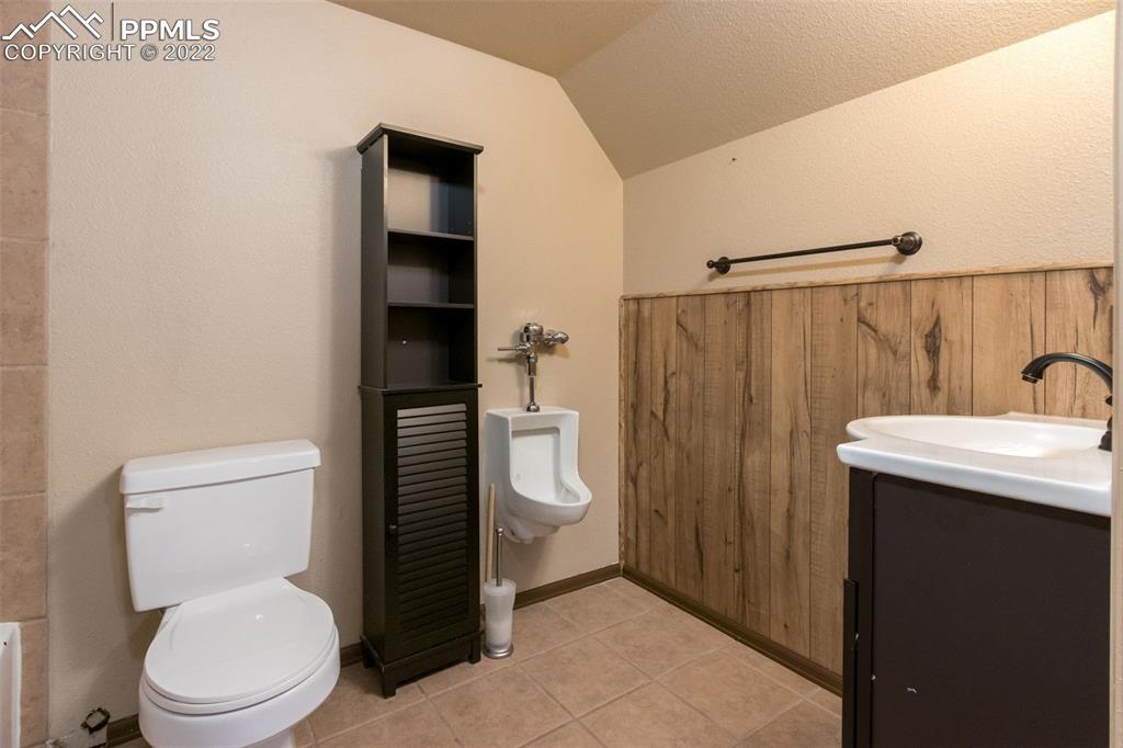 7542 Stephenville Road Peyton, CO 80831 - Photo 21 of 32 a white toilet sitting next to a bathroom sink