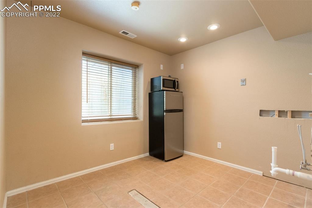 7542 Stephenville Road Peyton, CO 80831 - Photo 23 of 32 a view of an empty room with a window