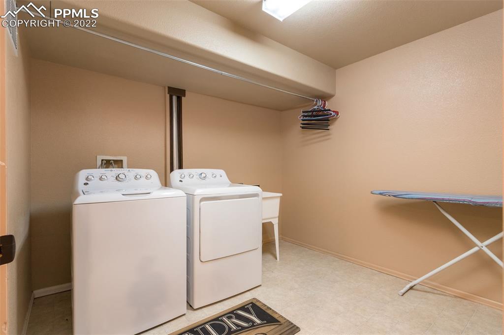 7542 Stephenville Road Peyton, CO 80831 - Photo 29 of 32 a utility room with dryer and washer