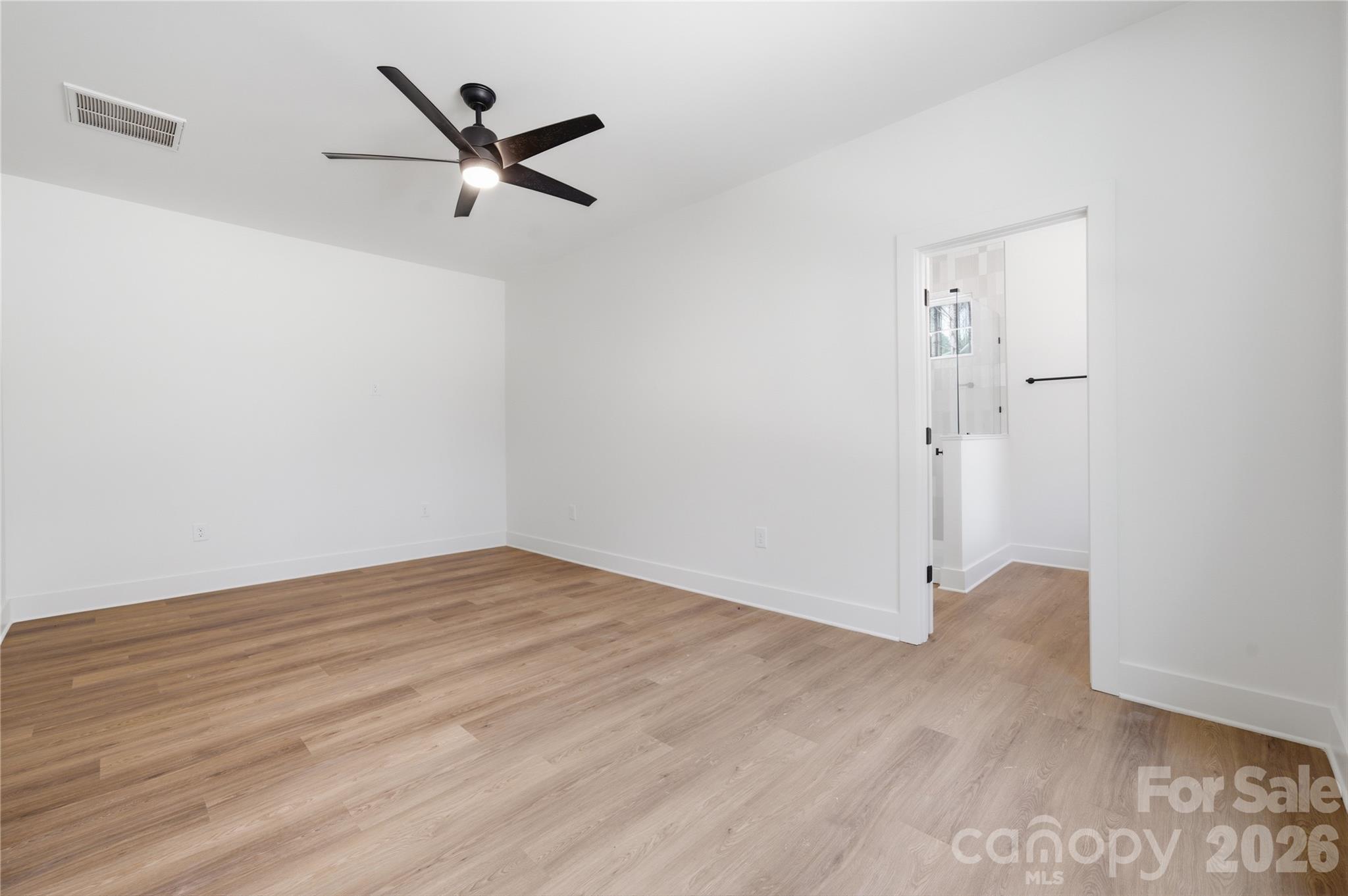 1412 Quiver Way York, SC 29745 - Photo 17 of 43 a view of a room with wooden floor and a ceiling fan