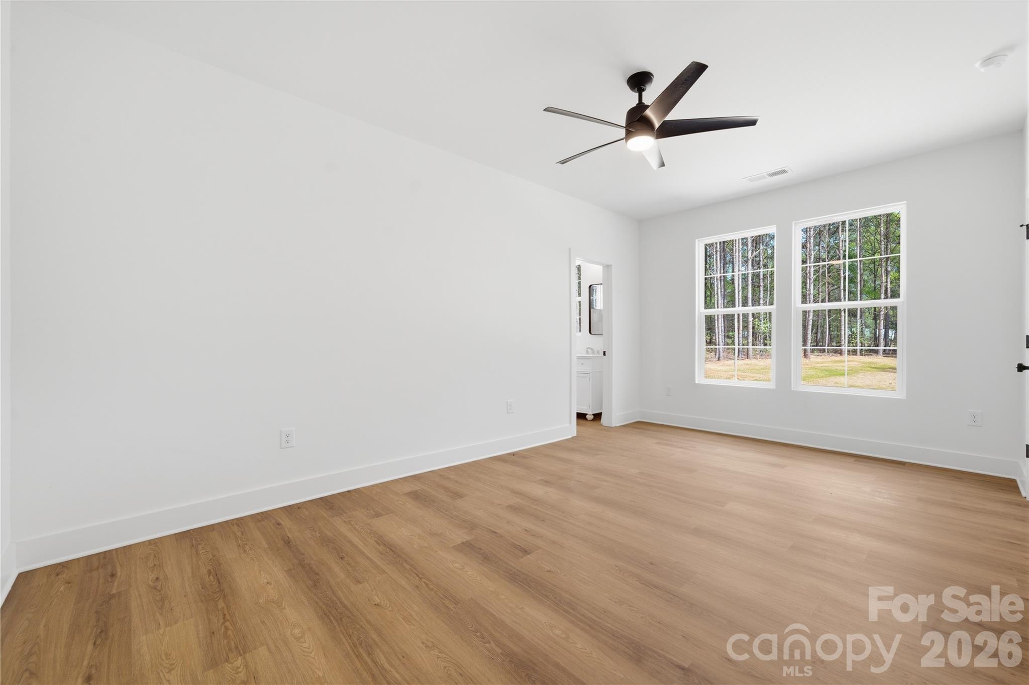 1412 Quiver Way York, SC 29745 - Photo 24 of 43 an empty room with window and ceiling fan