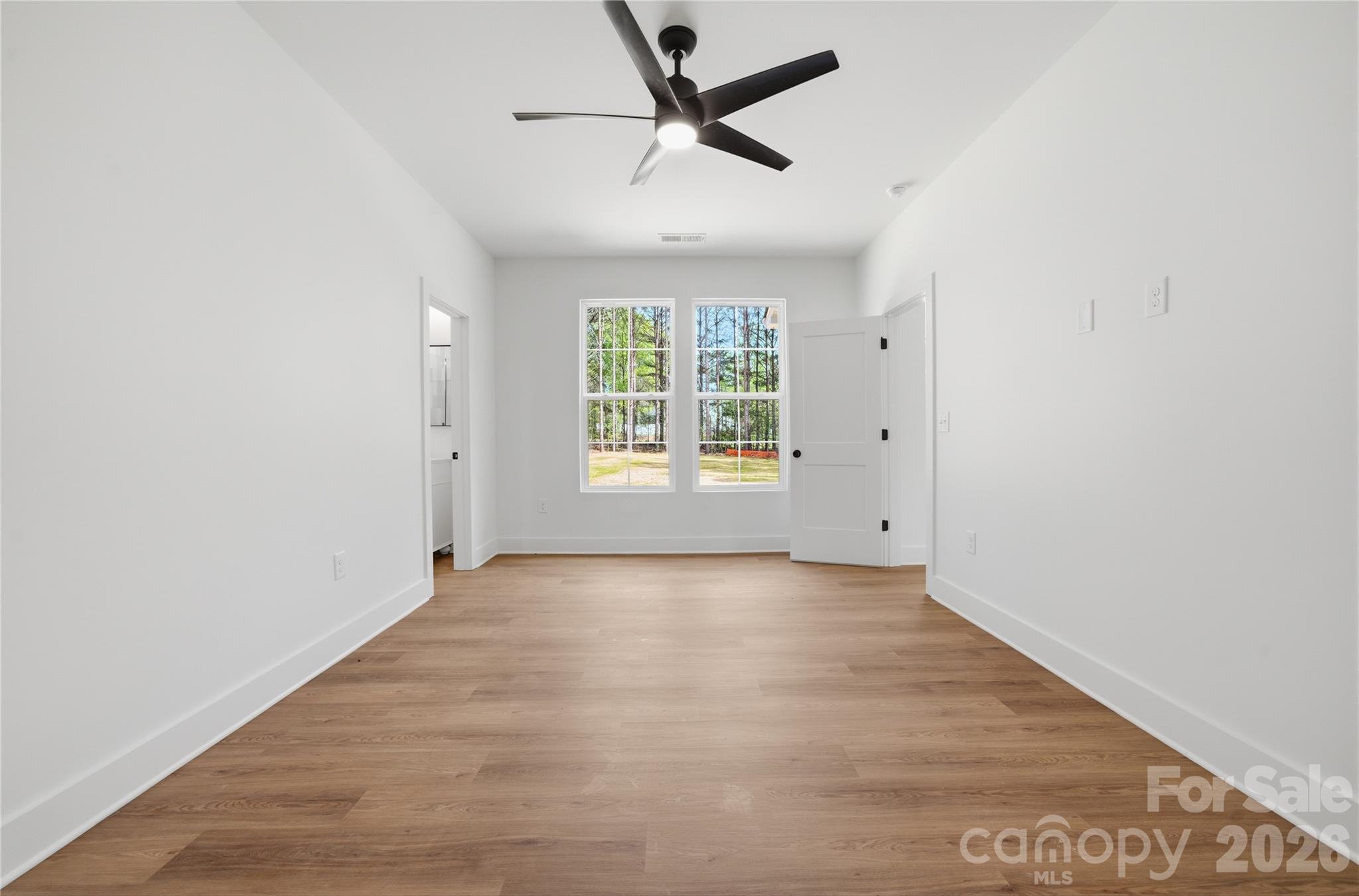 1412 Quiver Way York, SC 29745 - Photo 25 of 43 wooden floor in an empty room with a window