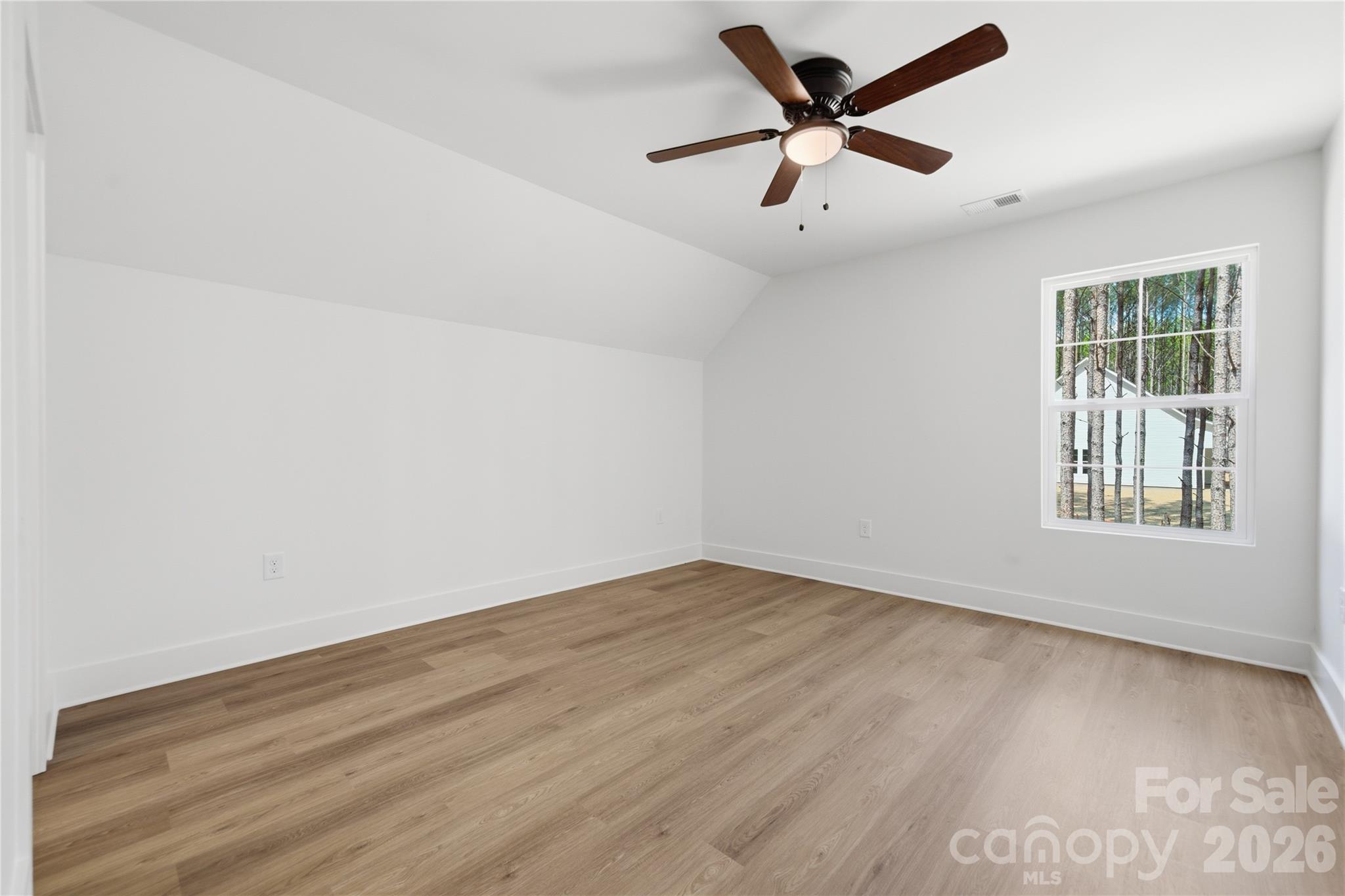 1412 Quiver Way York, SC 29745 - Photo 29 of 43 an empty room with wooden floor fan and windows