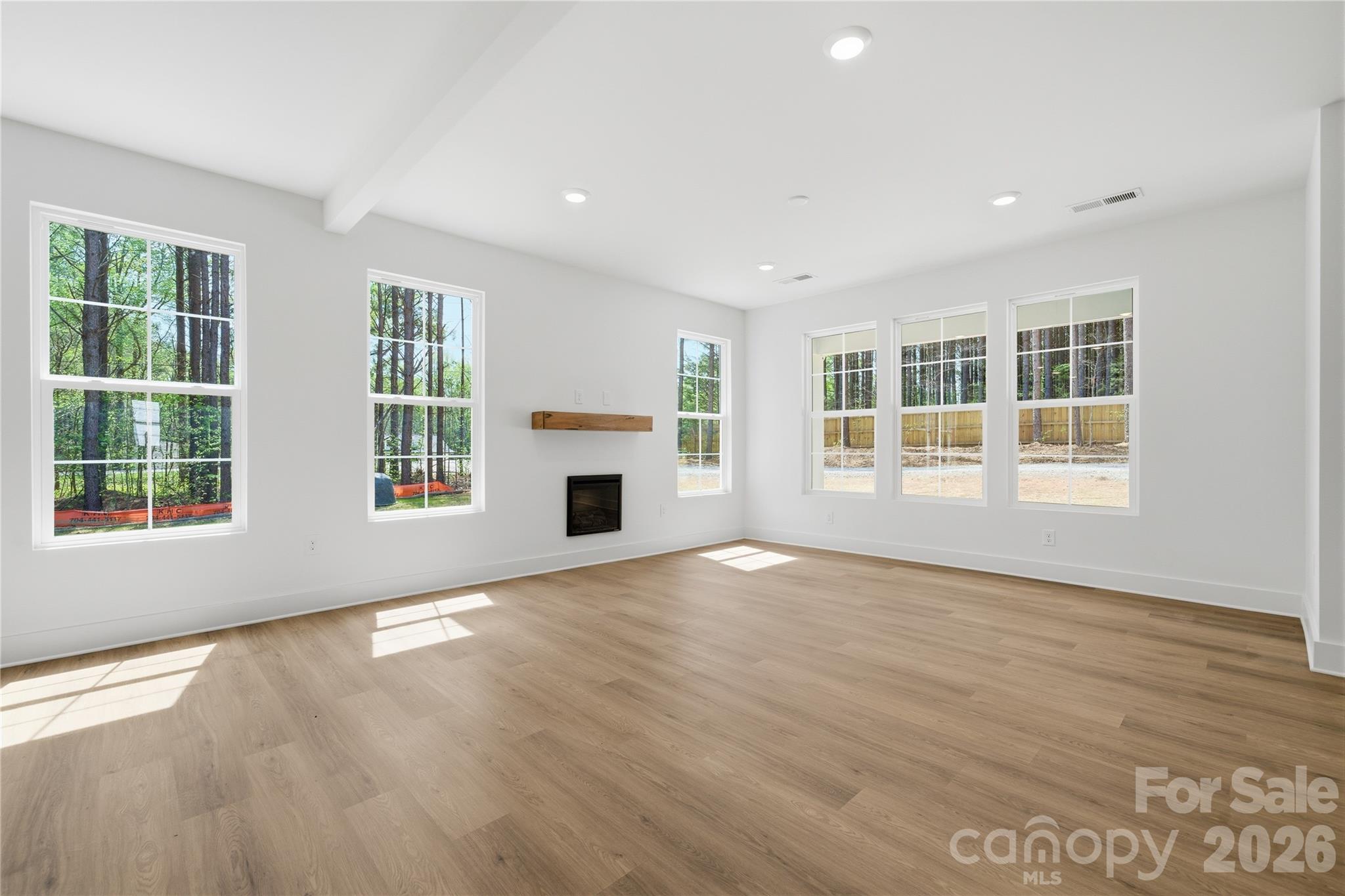 1412 Quiver Way York, SC 29745 - Photo 8 of 43 an empty room with windows and fireplace