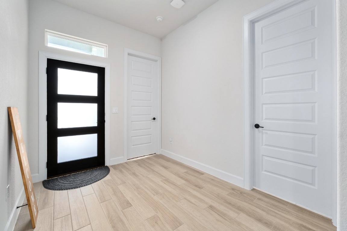 4513 Sea Salt Drive Austin, TX 78747 - Photo 11 of 31 a view of empty room with wooden floor