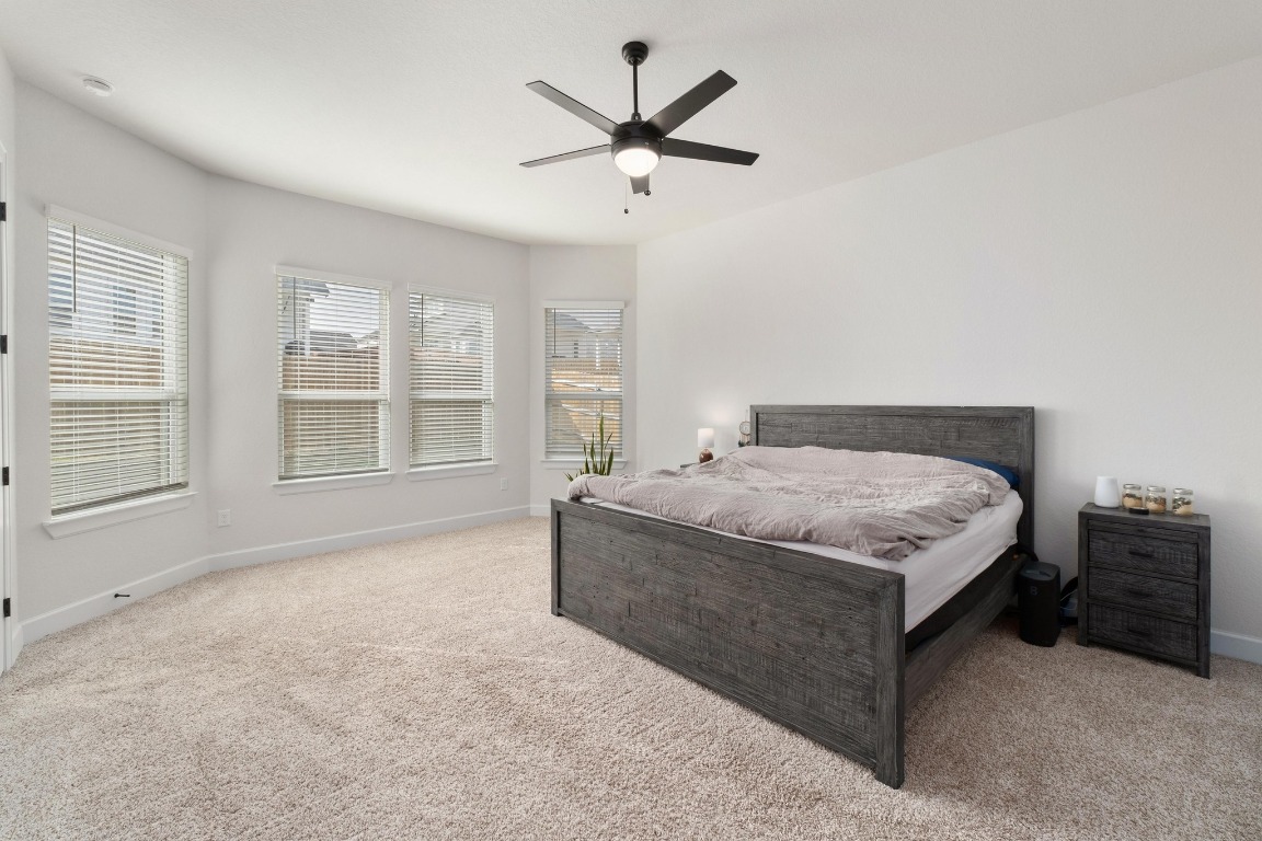 4513 Sea Salt Drive Austin, TX 78747 - Photo 13 of 31 a bedroom with a bed and window