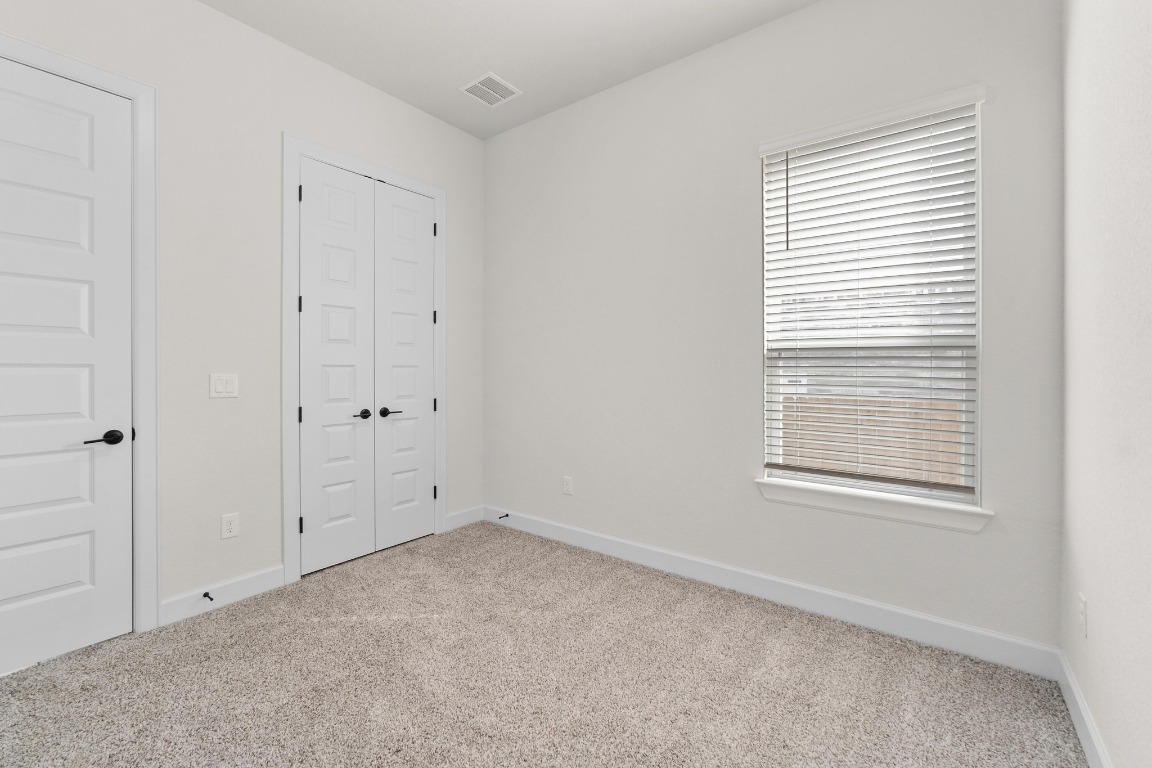 4513 Sea Salt Drive Austin, TX 78747 - Photo 20 of 31 a view of an empty room with a window
