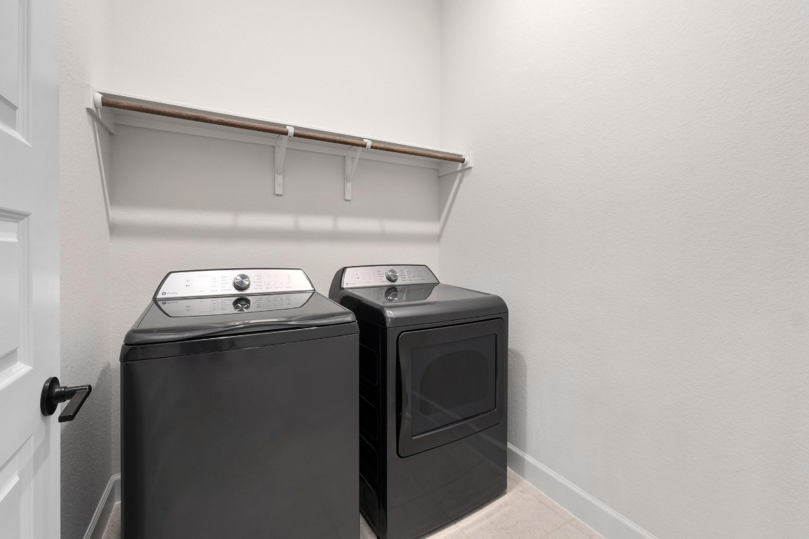 4513 Sea Salt Drive Austin, TX 78747 - Photo 23 of 31 a utility room with dryer and washer