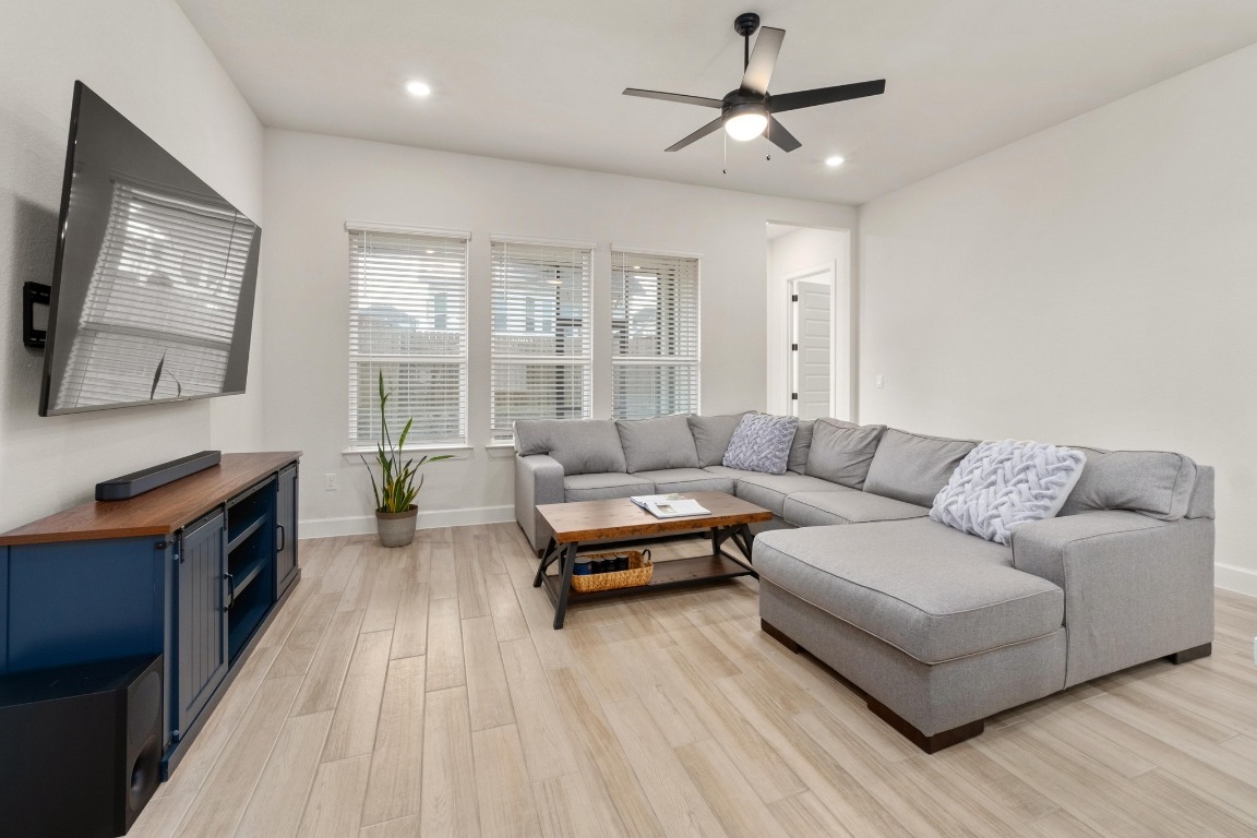4513 Sea Salt Drive Austin, TX 78747 - Photo 4 of 31 a living room with furniture and a fireplace