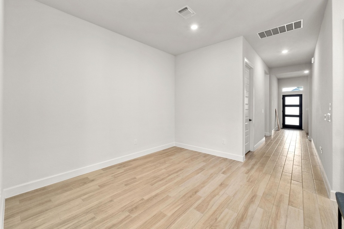 4513 Sea Salt Drive Austin, TX 78747 - Photo 9 of 31 wooden floor in a hall with an entryway