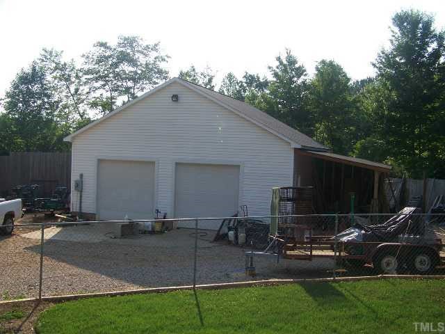 603 Lawrence Road Wake Forest, NC 27587 - Photo 12 of 12 32'x32' Garage / Shop with side "lean-to". Wired & Insulated.