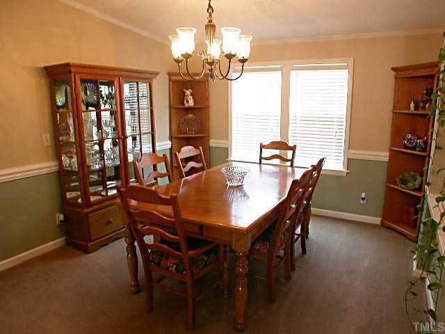 Large Formal Dining Room with chair rail & crown molding
