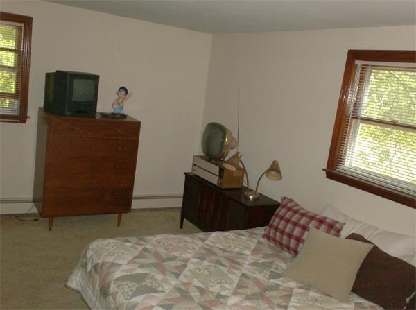 63 Allen Road Easton, MA 02356 - Photo 12 of 15 a bedroom with a bed and flat tv screen on the dresser