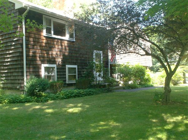 63 Allen Road Easton, MA 02356 - Photo 6 of 15 a view of backyard with plants and large tree