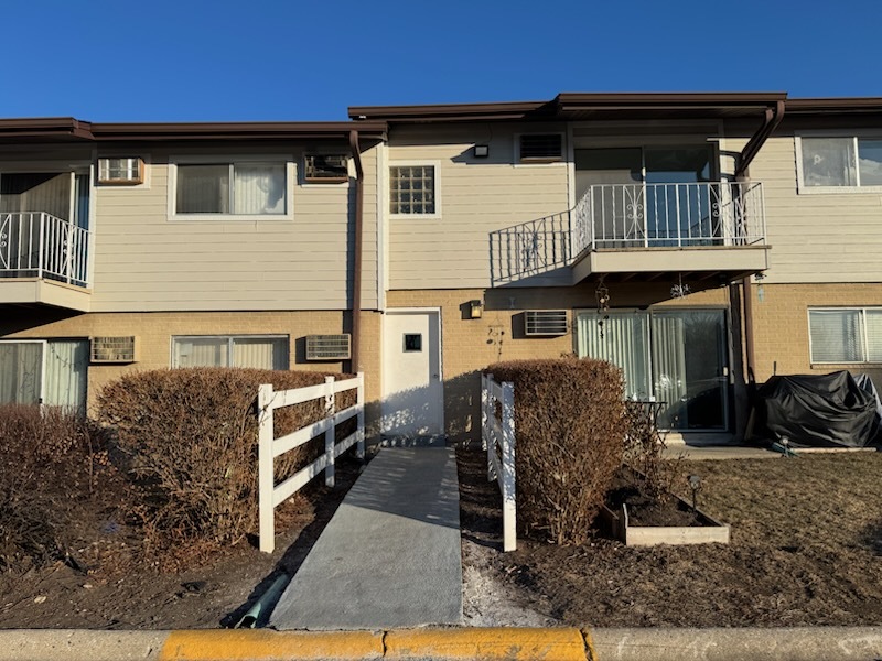 850 East Old Willow Road, Unit 218 Prospect Heights, IL 60070 - Photo 2 of 11 a front view of a house with entertaining space