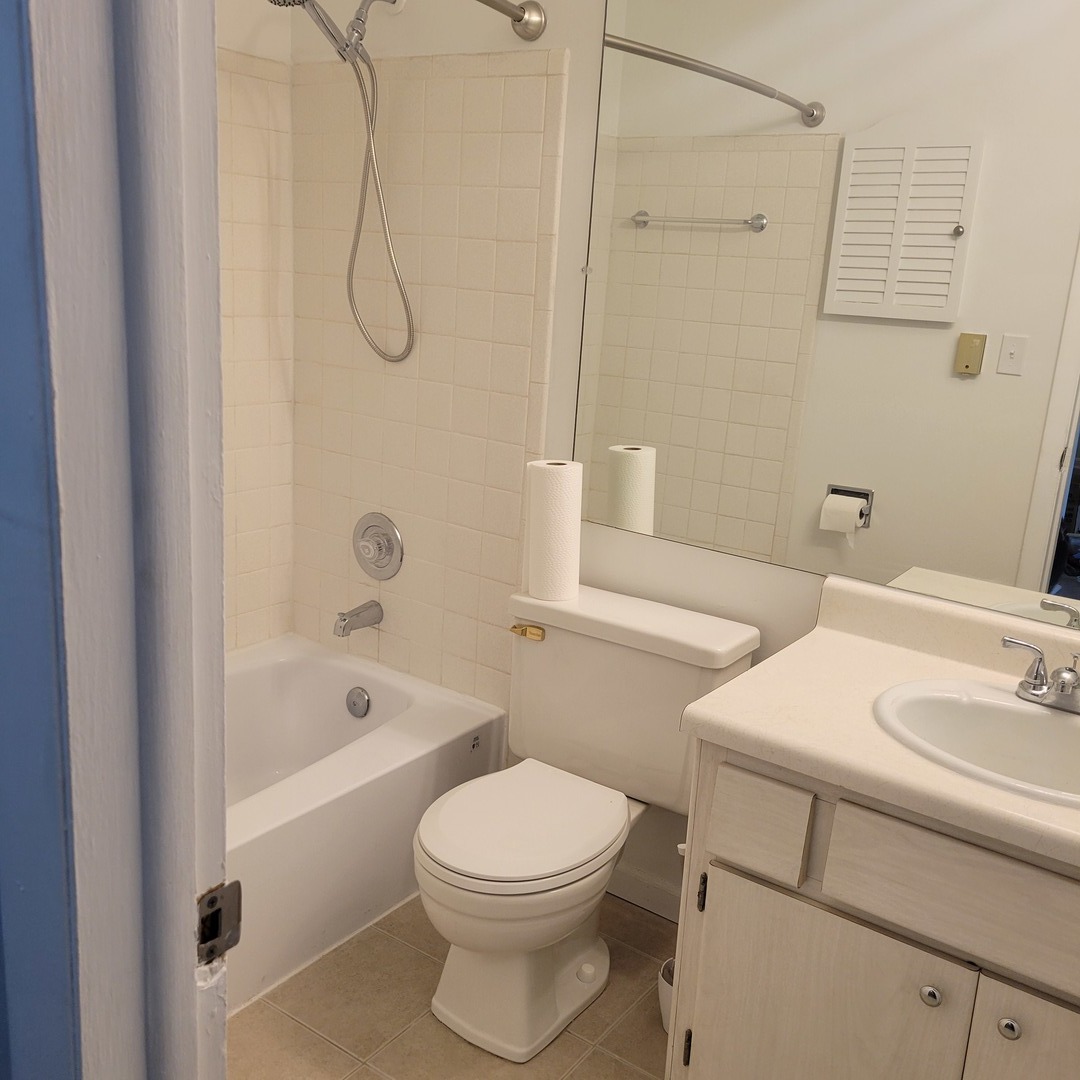 850 East Old Willow Road, Unit 218 Prospect Heights, IL 60070 - Photo 10 of 11 a bathroom with a sink toilet and shower