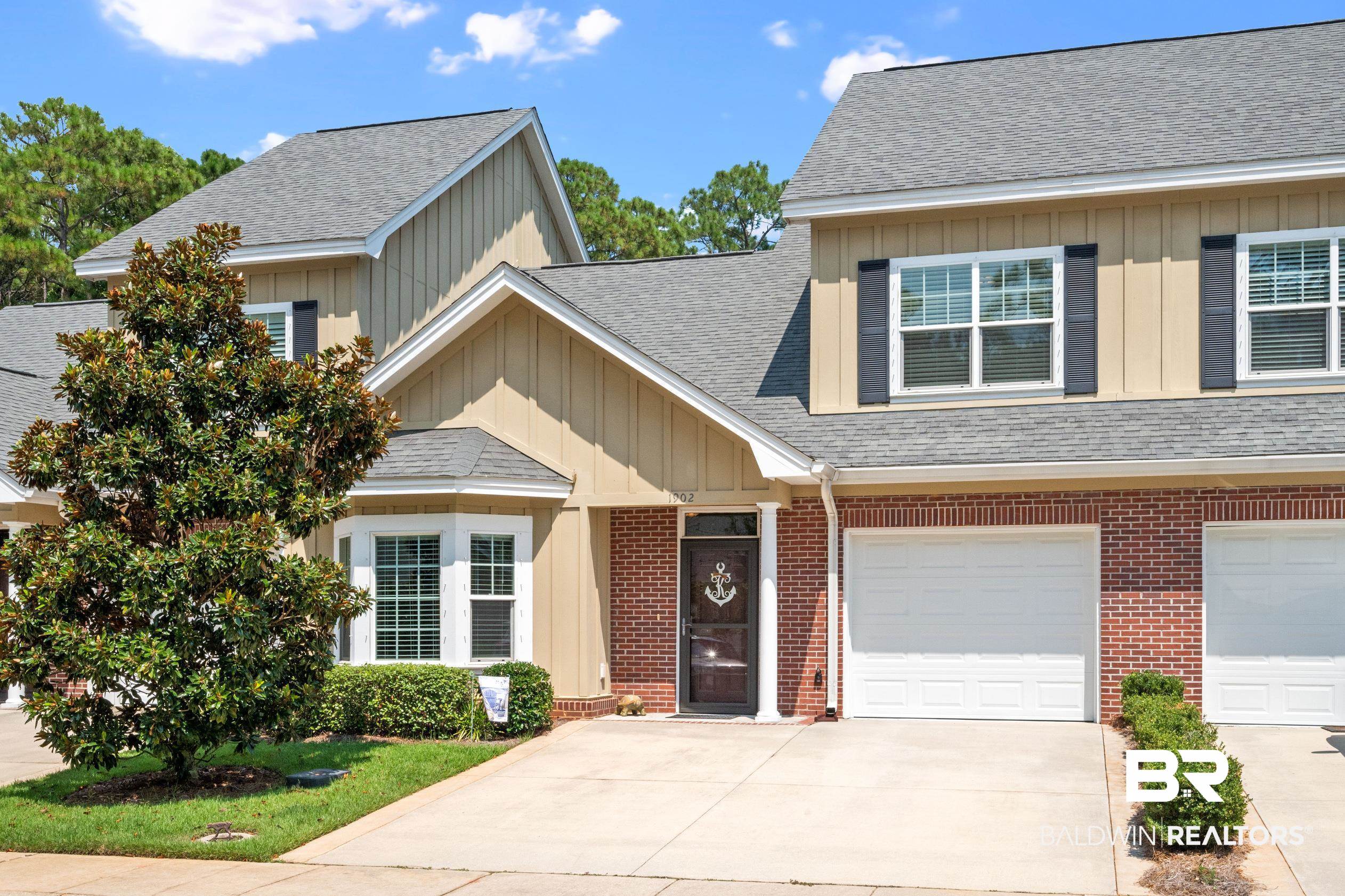 430 West Fort Morgan Road, Unit 1902 Gulf Shores, AL 36542 - Photo 1 of 59 View of front of home featuring a garage