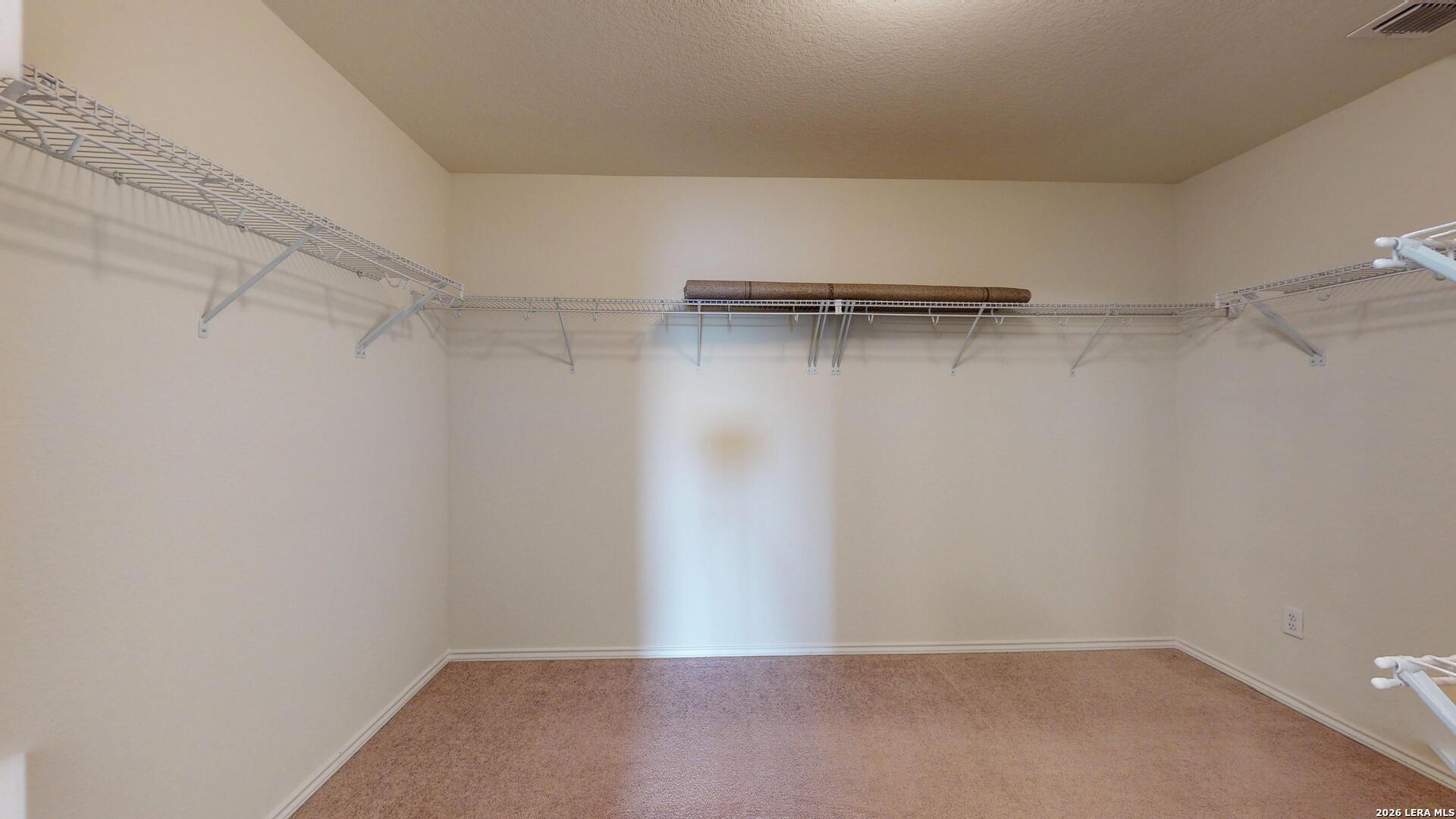 344 Autumn Rouge New Braunfels, TX 78130 - Photo 10 of 16 a view of a room with racks on the wall